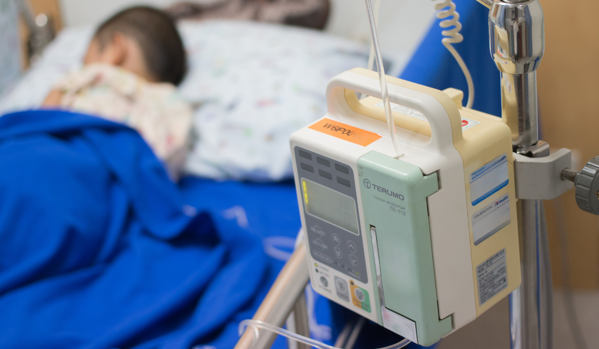 hospital equipment at home with child in bed