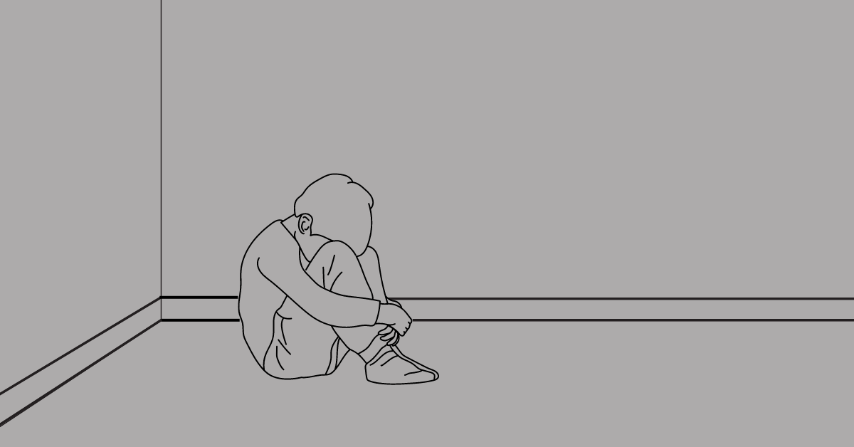 drawing of a child seated alone on the ground in a room