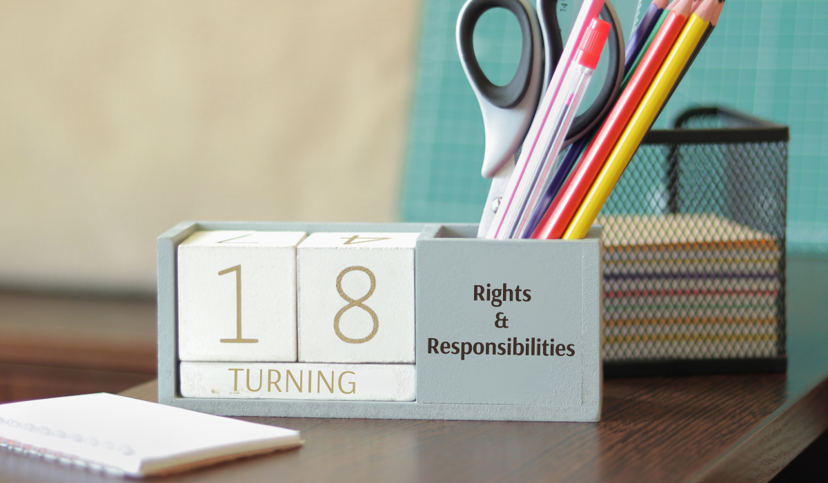 a desk with wood blocks with numbers 1 and 8 with text that says Turning 18- Rights and Responsibilities